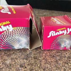 Three slinky toys