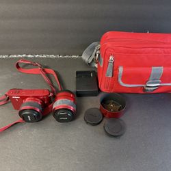 Nikon J1 Digital Camera With Two Lenses And Camera Bag