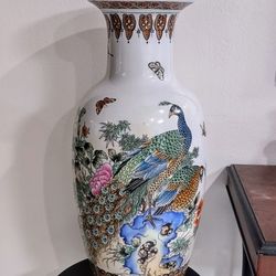 24" Tall- Oriental Porcelain Peacock; Butterflies and Flowers Design Vase; no marking on bottom.
