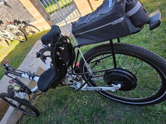 Tri  electric /manual pro bike with lots of extra parts extra 26 inc rear wjeel ,helmet,bag,shoes, sprockets,