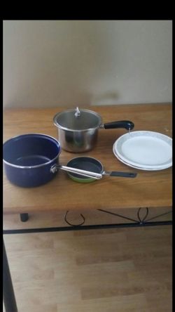Kitchen pots, pan, and plates.