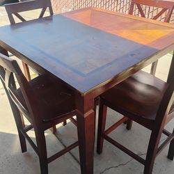 TABLE WITH 4 CHAIRS, HAS SCRATCHES CHECK THE PICTURES N NEEDS A CLEAN UP