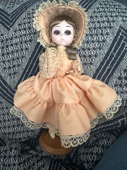 Vintage Porcelain Doll with Peach Dress