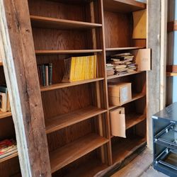 Large two-sided wooden public library shelves