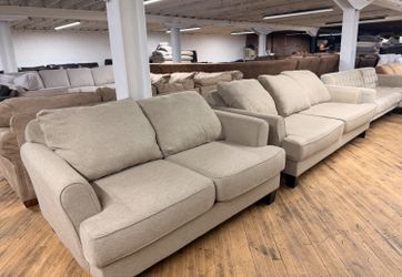 Delivery Available Beige sofa/couch + loveseat