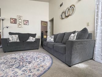 Ashley - sofa and love seat with cushions.