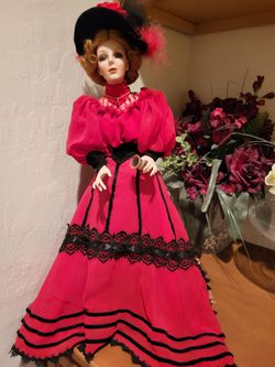 Coca-Cola dolls porcelain, perfect age $100. I have the red one, and I have the pink one