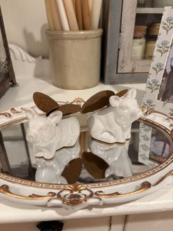 A pair of ceramic little adorable pigs