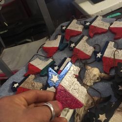 Handpainted state of Texas hanging decorations.