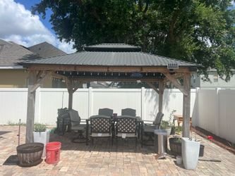Gazebo with table and 6 chairs