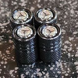 Mercedes-Benz Black 4pc Valve Stem Cap Set.
