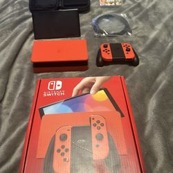 Like New Nintendo Switch - OLED Model: Mario Red Edition with travel case& Grand theft auto trilogy….