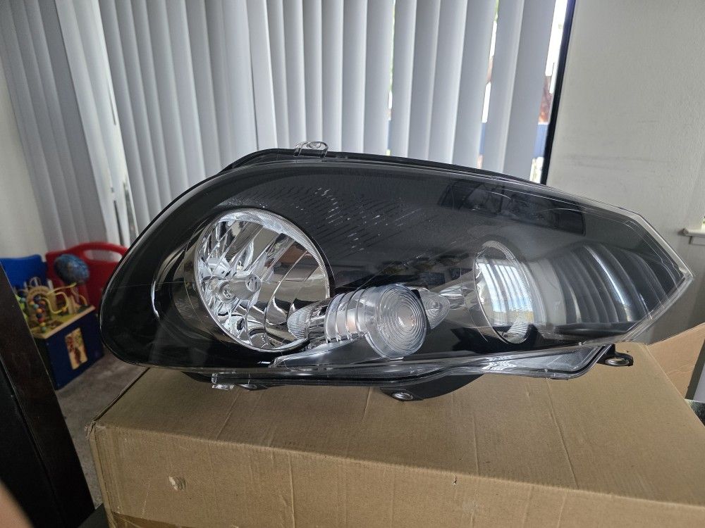 Hella brand headlight for a Volkswagen Golf, MK6 model (e.g., 2011 VW Golf GTI)