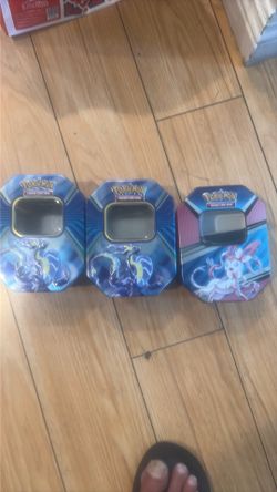 Three empty Pokeman boxes