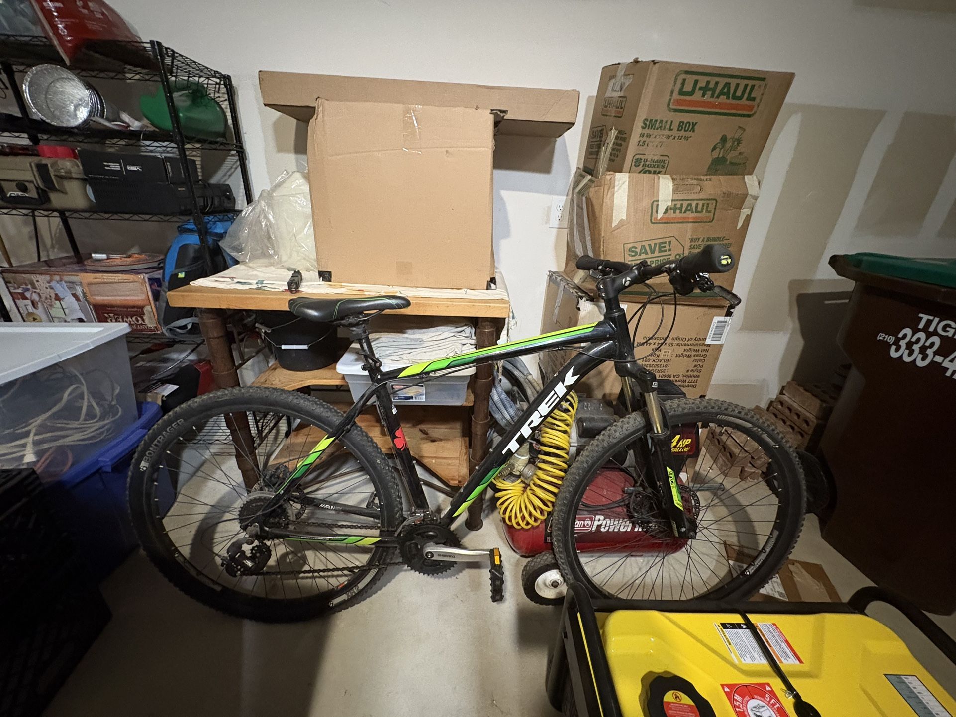 Trek All Terrain Mountain Bike It’s a Trek mountain bike (hardtail, front suspension only).  • The color scheme (black with green/yellow accents) look