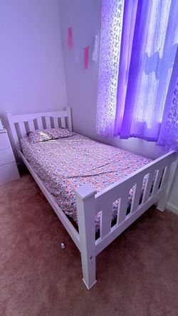 2 white Twin-size beds
