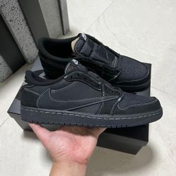 Black and red Travis Scott Jordan 1 low trainers