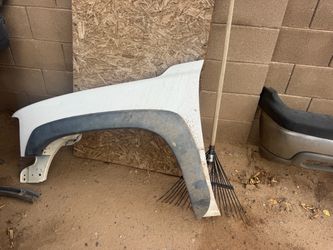 Driver side GMC Sierra 2500 fender from a 2002