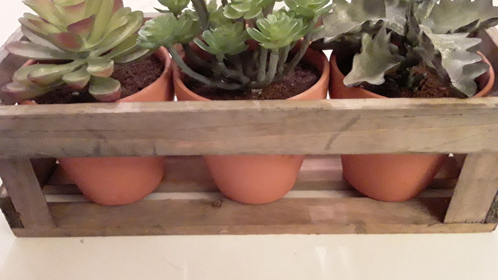 Brand new beautiful wood table top piece with 3 artificial succulents plants in clay pots. Gorgeous!!!