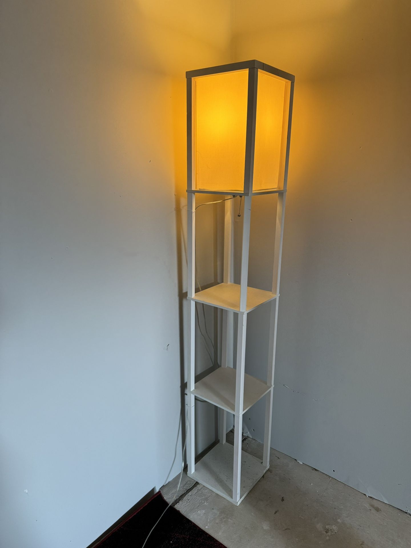 White wooden floor lamp with 3 shelves for decor