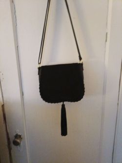 Black suede and leather crossbody with tassel