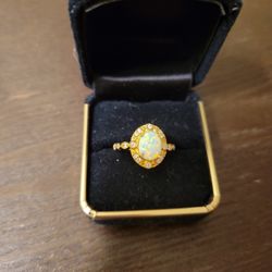 Beautiful costume opal ring.  I have never worn.  Size 5 1/2.