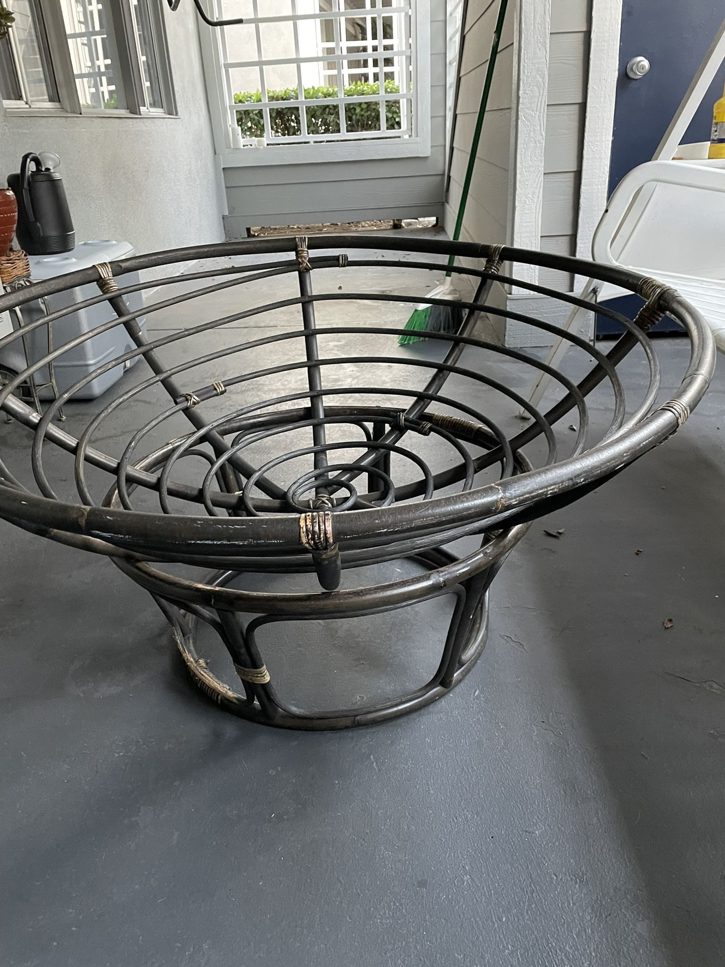 Rattan Papasan Chair Frame With A Brown Cushion
