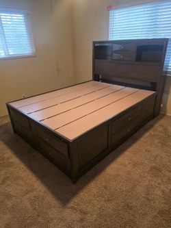 Living Spaces Queen Dark Wood 6 Drawer Storage Platform Bed Bookcase Headboard