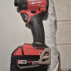 Milwaukee M18 FUEL 1/4" Hex Impact Driver with m18 red lithium xc 5.0 battery