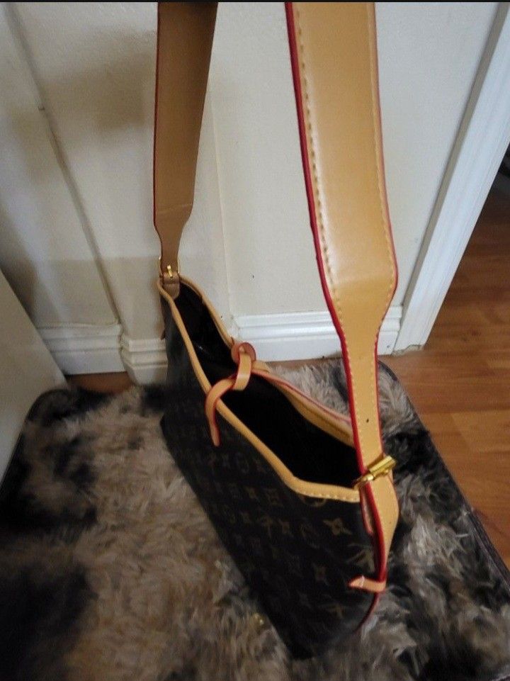 👜
