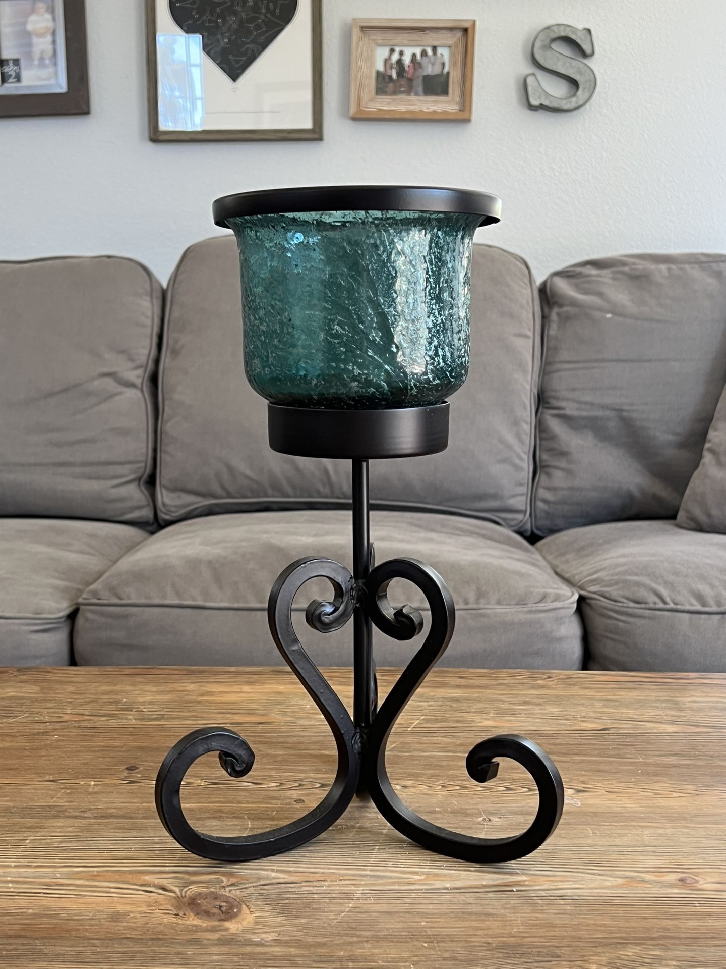 Candle glass and iron holder.