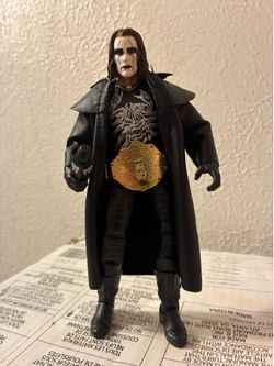 WWE Defining Moments Sting Action Figure w/Belt, Microphone, and Coat