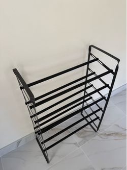 Adjustable shoe rack. 24”-45” and can fit small and￼ large shoes. Pick up in Pasadena.