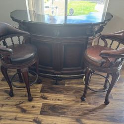 Thomasville Hemingway "Trophy" Series bar and matching leather revolving stools.  Bar Top: Features a sunken marble inset and matching marble cutting 