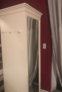 Full mirror with storage space