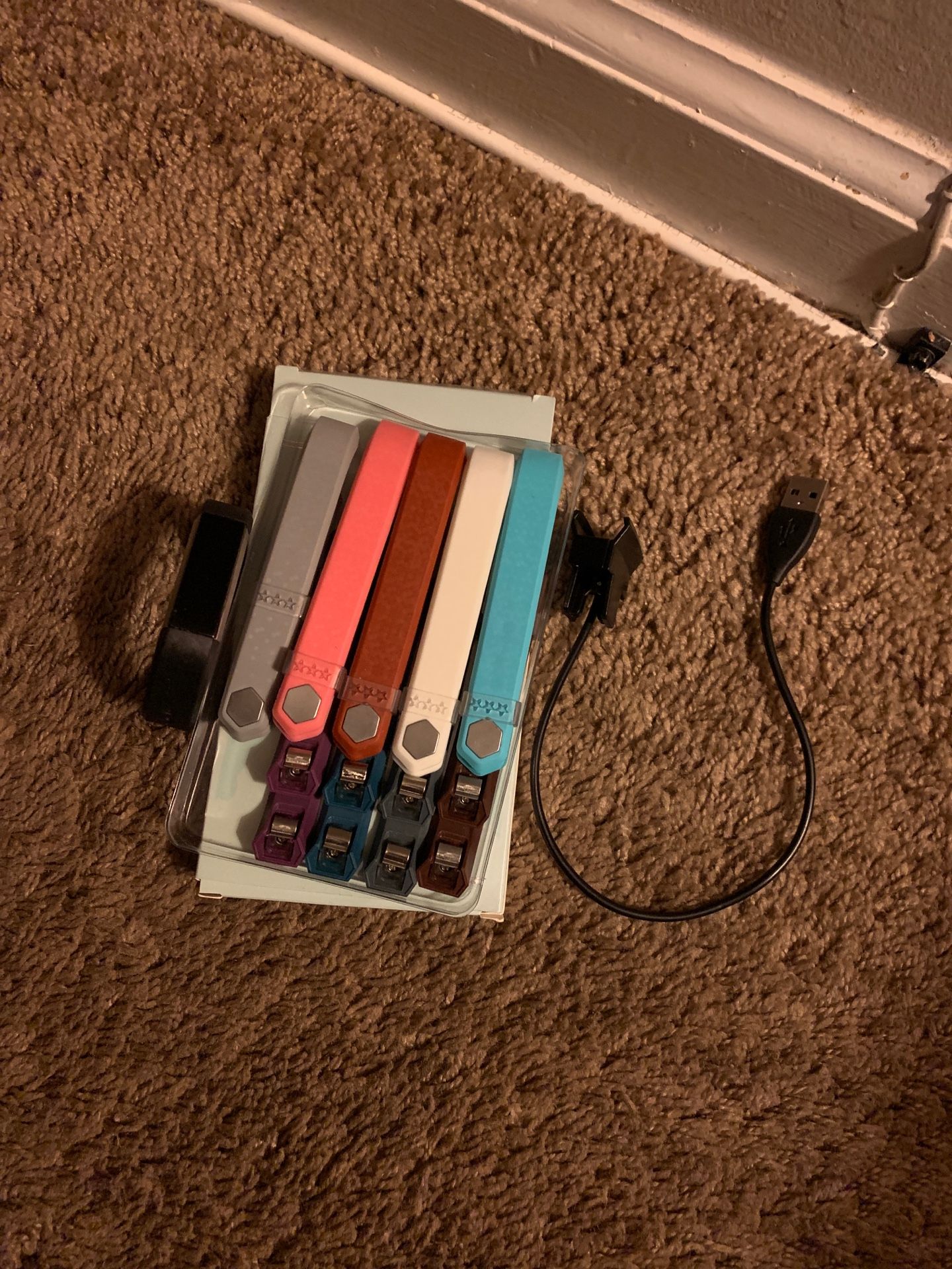 Fitbit with 8 never used bands and charging cord