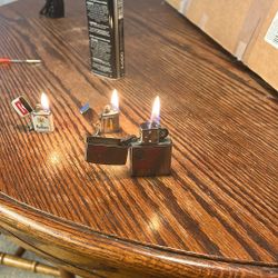 One Zippo And Two Miniature Like Zippo’s
