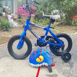 Toddler Bike. With Helmet, Sat In The Garage And Needs Two New Inner Tubes.  Other Than That, The Bike Is In Great Shape.