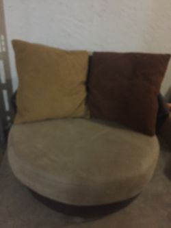 Rotatable couch with two pillows