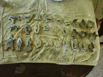 Lot of 28 vintage tin cookie and cake cutters