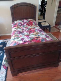 Twin bed with orthopedic mattress