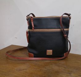 Dooney and bourke Black Pebbled Leather Tan trim Crossbody Bag