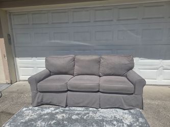 Gray Slipcovered 3 Cushion Sofa