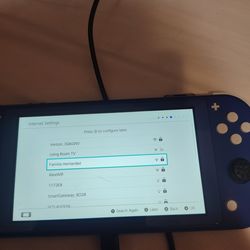 “Nintendo Switch Lite – powers on, ZL button & game slot not working – good for repair or parts”