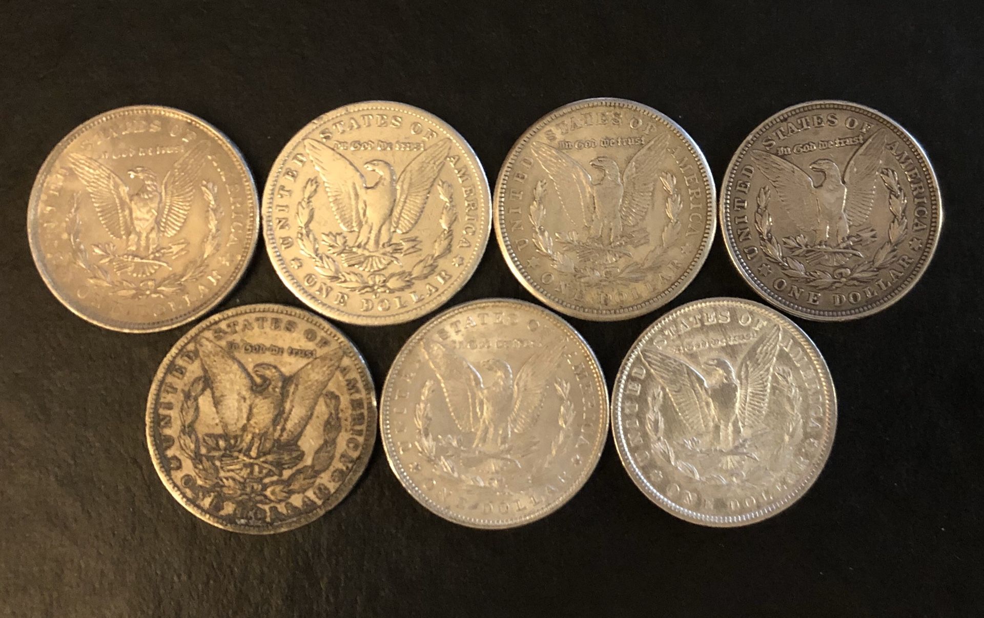 7 Morgan Silver Dollars
