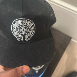 Chrome Hearts Horseshoe Baseball Hat in black. It features the brand's iconic "Horseshoe" logo embroidered on the front, which incorporates the "Chrom