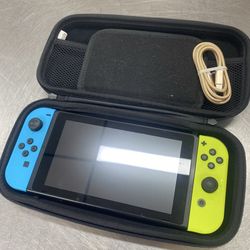 Nintendo Switch with charging cord hard carrying case