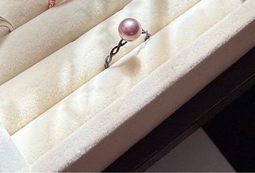 Real fresh water pink pearl with .925 black band