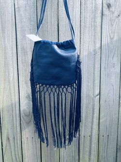 NWT free People navy fringe Crossbody. 7 inches tall 7 wide 30 inches tall