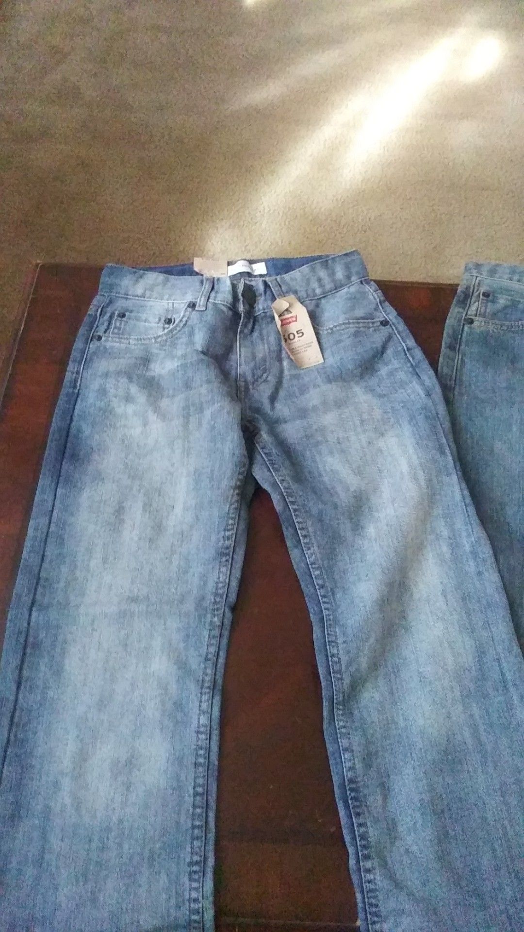 I m selling 2 pairs of boy jean size 10 REG with the tags still on it